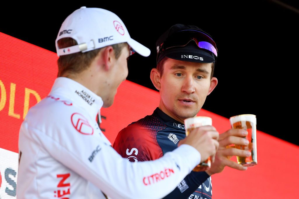 VALKENBURG NETHERLANDS APRIL 10 LR Benoit Cosnefroy of France and AG2R Citren Team on second place and race winner Michal Kwiatkowski of Poland and Team INEOS Grenadiers cheer to celebrate on the podium during the podium ceremony after the 56th Amstel Gold Race 2022 Mens Elite a 2541km one day race from Maastricht to Valkenburg AGR2022 WorldTour on April 10 2022 in Valkenburg Netherlands Photo by Luc ClaessenGetty Images