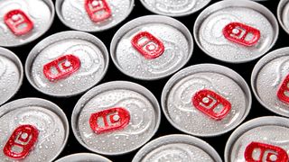 Overhead image of multiple drinks cans with red ring pulls