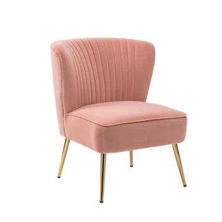 A pink accent chair with gold legs