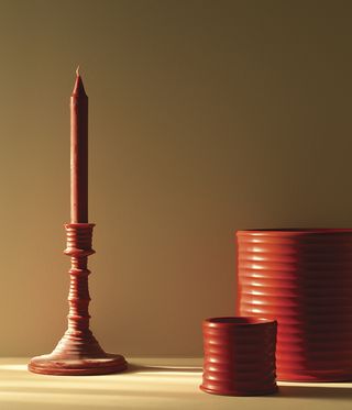 Loewe tomato scented candles and candelabra.
