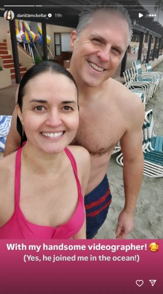 A selfie of Danica McKellar and her husband after jumping in the ocean. The caption says: "With my handsome vidographer! (Yes, he joined me in the ocean!)"