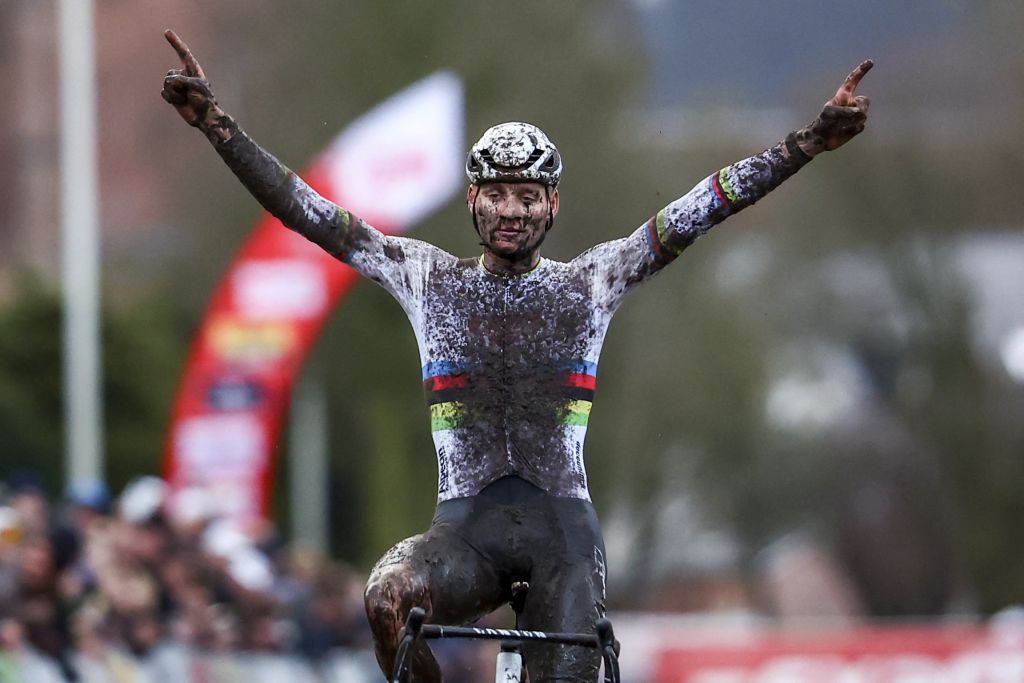Dutch Mathieu Van Der Poel celebrates as he crosses the finish line to win the men's elite race of the cyclocross cycling event, race 4/6 in the 'Exact Cross' competition, Friday 29 December 2023 in Loenhout. BELGA PHOTO DAVID PINTENS (Photo by DAVID PINTENS / BELGA MAG / Belga via AFP)