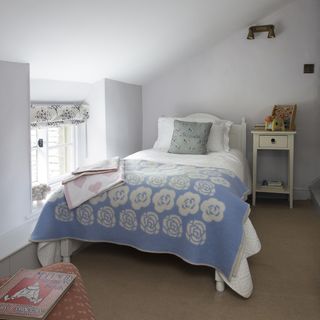 bedroom with blue bedlinen in farmhouse