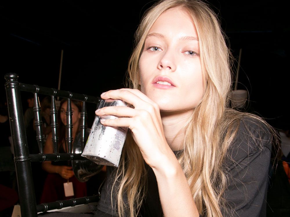 Photo of a model drinking Birch Tree Water