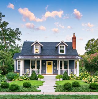 Front yard landscaped with a mixture of shrubs and greenery