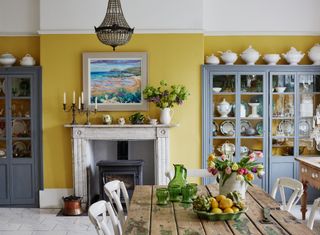kitchen with yellow walls and china in Georgian townhouse