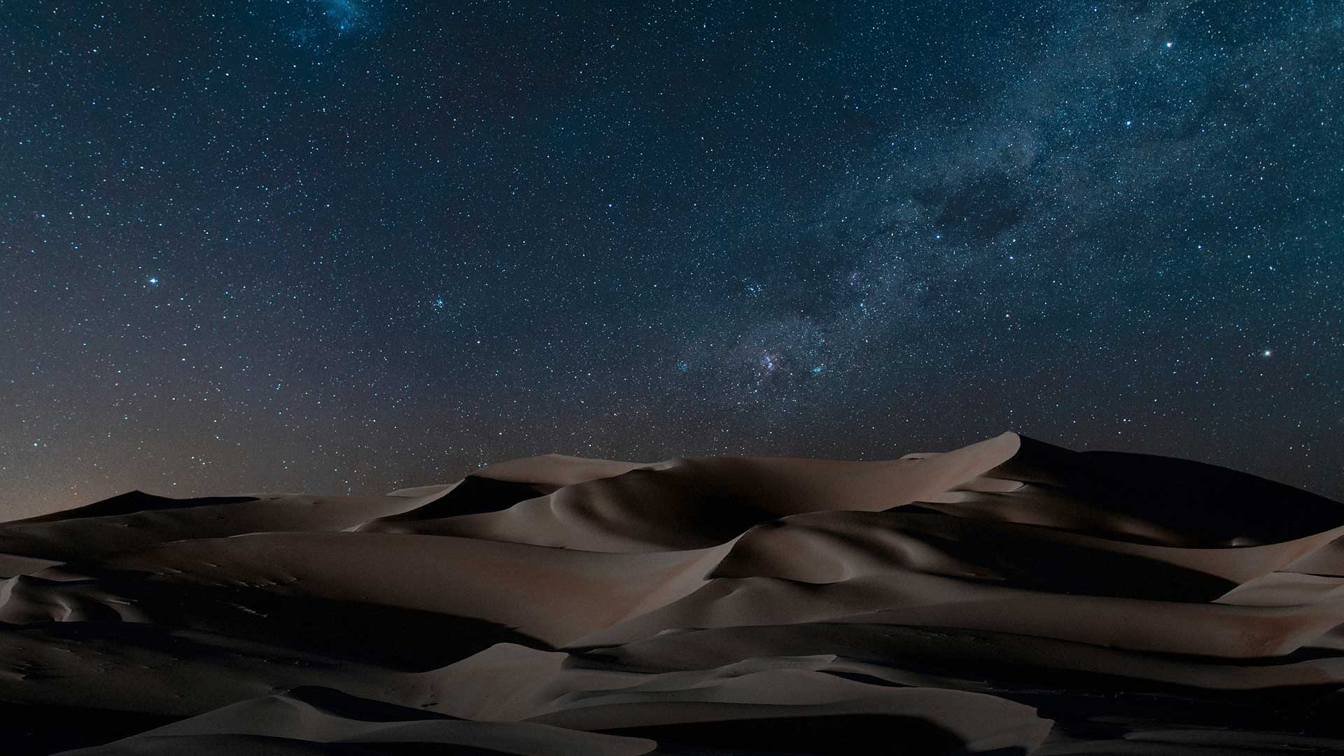 A photo of the Namib desert under stars