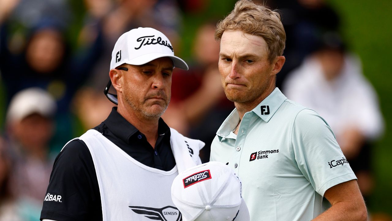 Will Zalatoris and his caddie on the 18th green at the Genesis Invitational