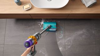 Dyson V15s Detect Submarine mopping the floor beneath a sink 