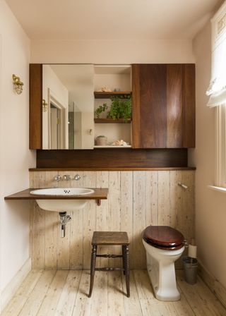 Small wooden panelled bathroom