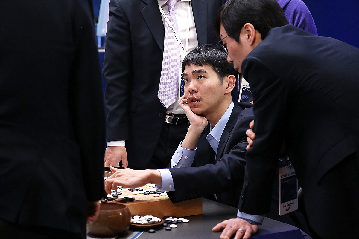 South Korean Go player Lee Sedol reviews the match with other professional Go players after the final match against Google's AI program, AlphaGo.