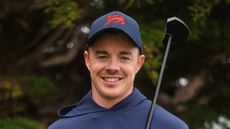 A headshot of 2025 Walker Cup player, Stuart Grehan holding his putter over his left shoulder