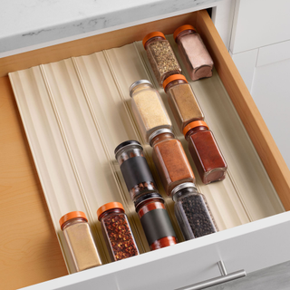 A spice drawer organizer with spices