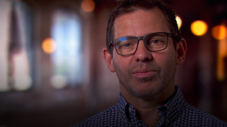 John Tesar giving an interview during an episode of Top Chef.