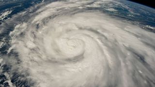 satellite photo shows hurricane ian as it moves towards cuba in the Caribbean Sea east of Belize