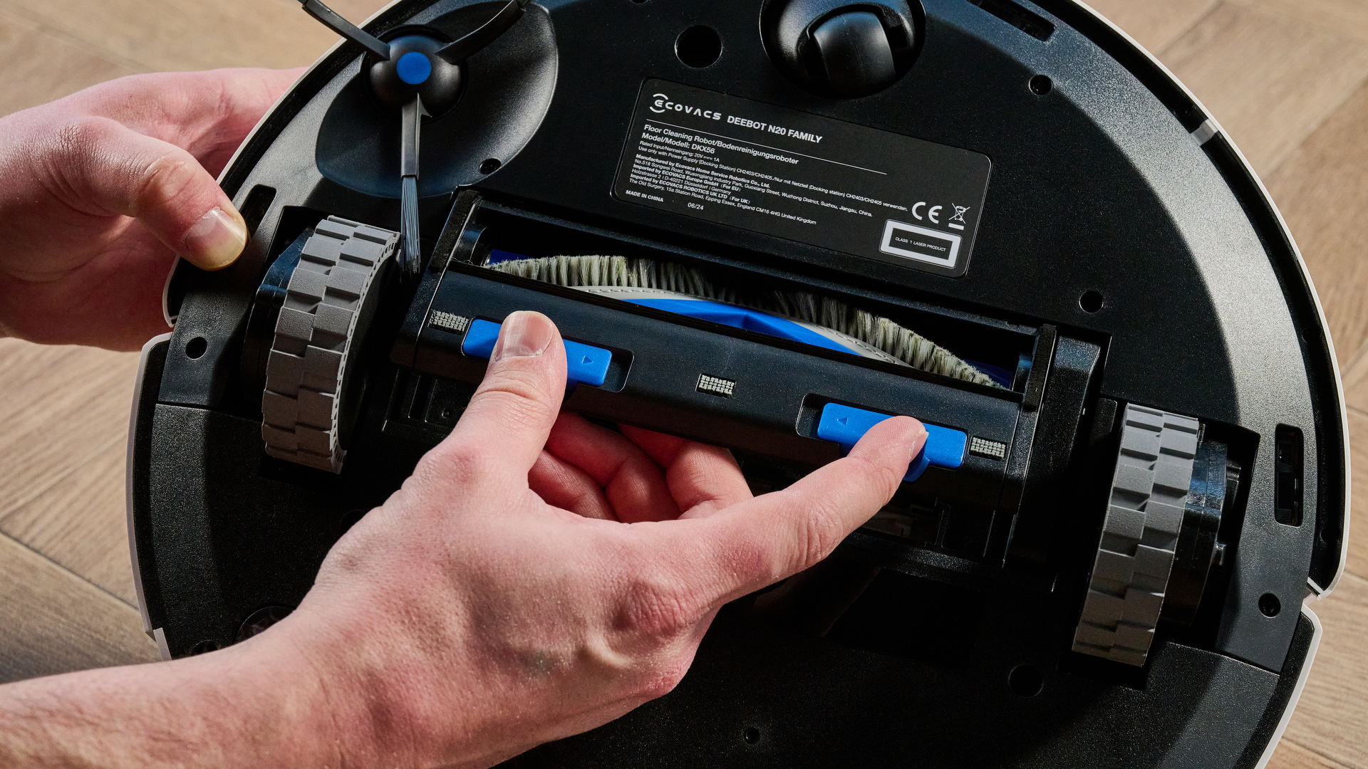 Ecovacs Deebot N20 in white photographed vacuuming floor