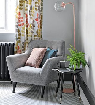 living room with armchair with cushions