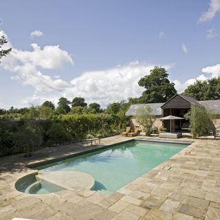 exterior of house with trees and pool