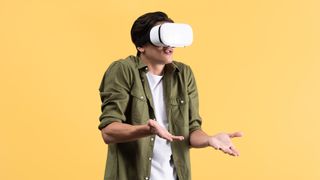 irritated young man with shrug gesture using vr headset