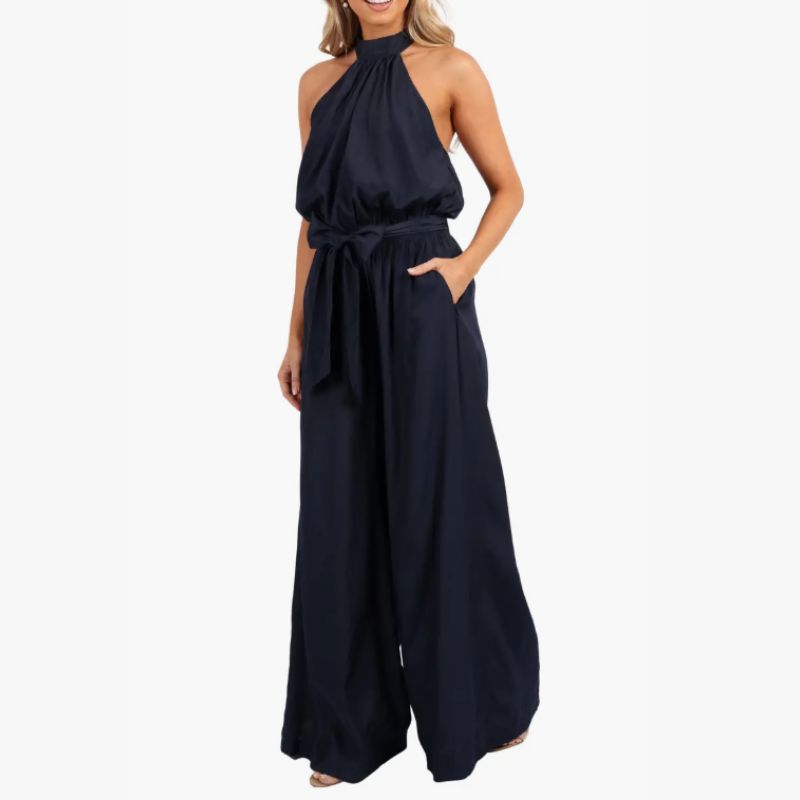 halter neck navy jumpsuit with wide legs and belted waist