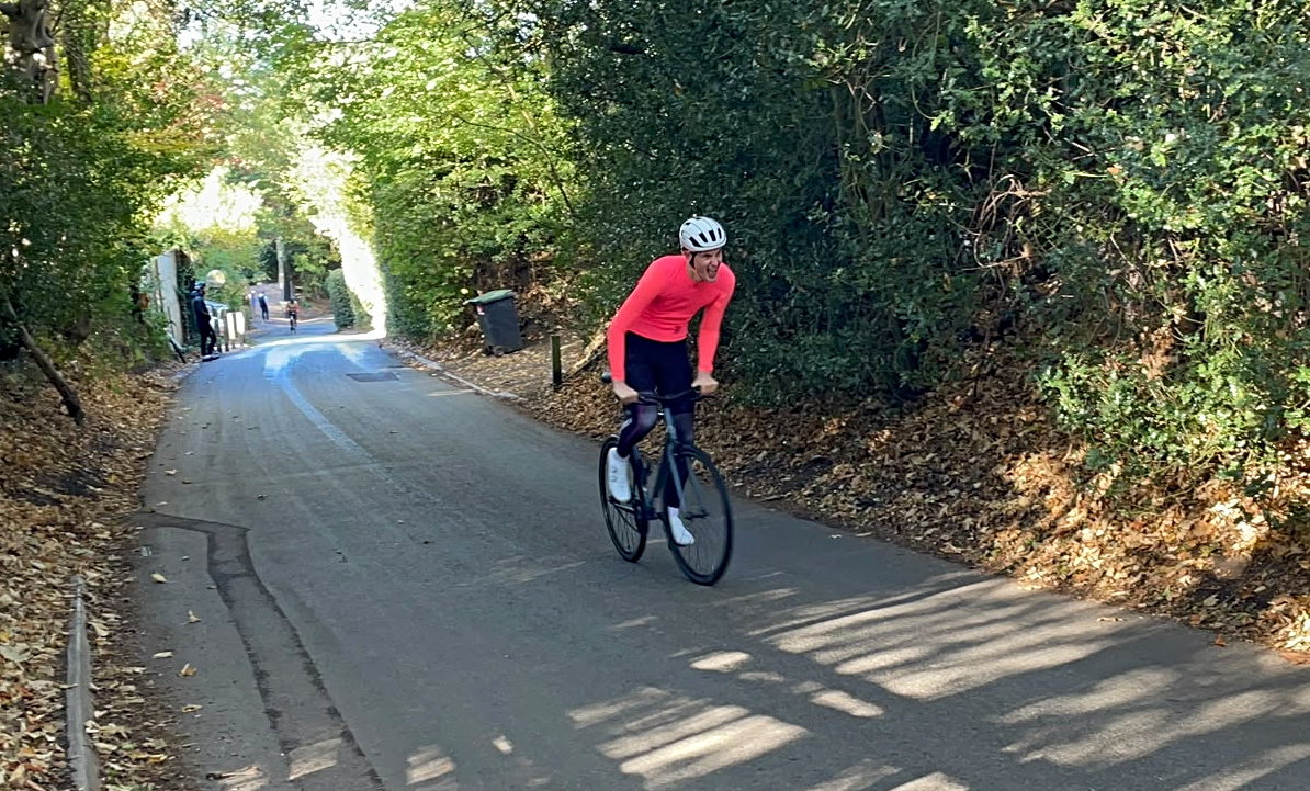 A rider competing on a single-speed bike in a hill-climb competition
