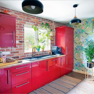 red gloss kitchen with wallpaper