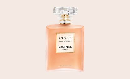 Chanel Sweet Dream's fragrance. Pink bottle with a round clear lid.