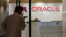 Man pictured walking in the entrance to the Oracle office in Hong Kong. 