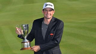 Keegan Bradley with the Travelers Championship trophy