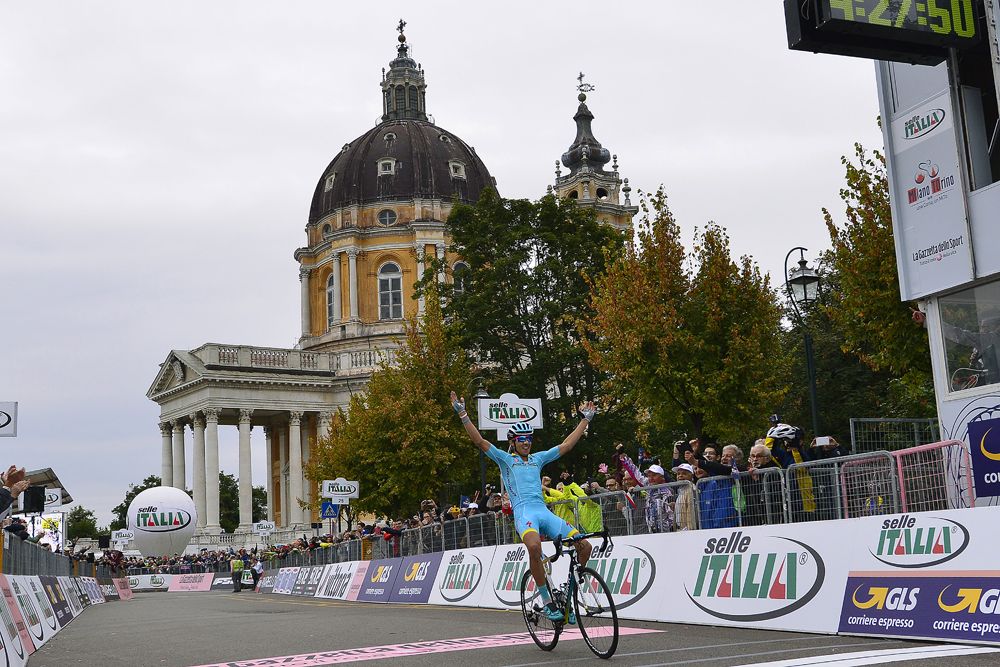 Rosa crosses the line with the Basilica di Superga in the background