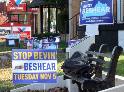 Signs supporting Andy Beshear.