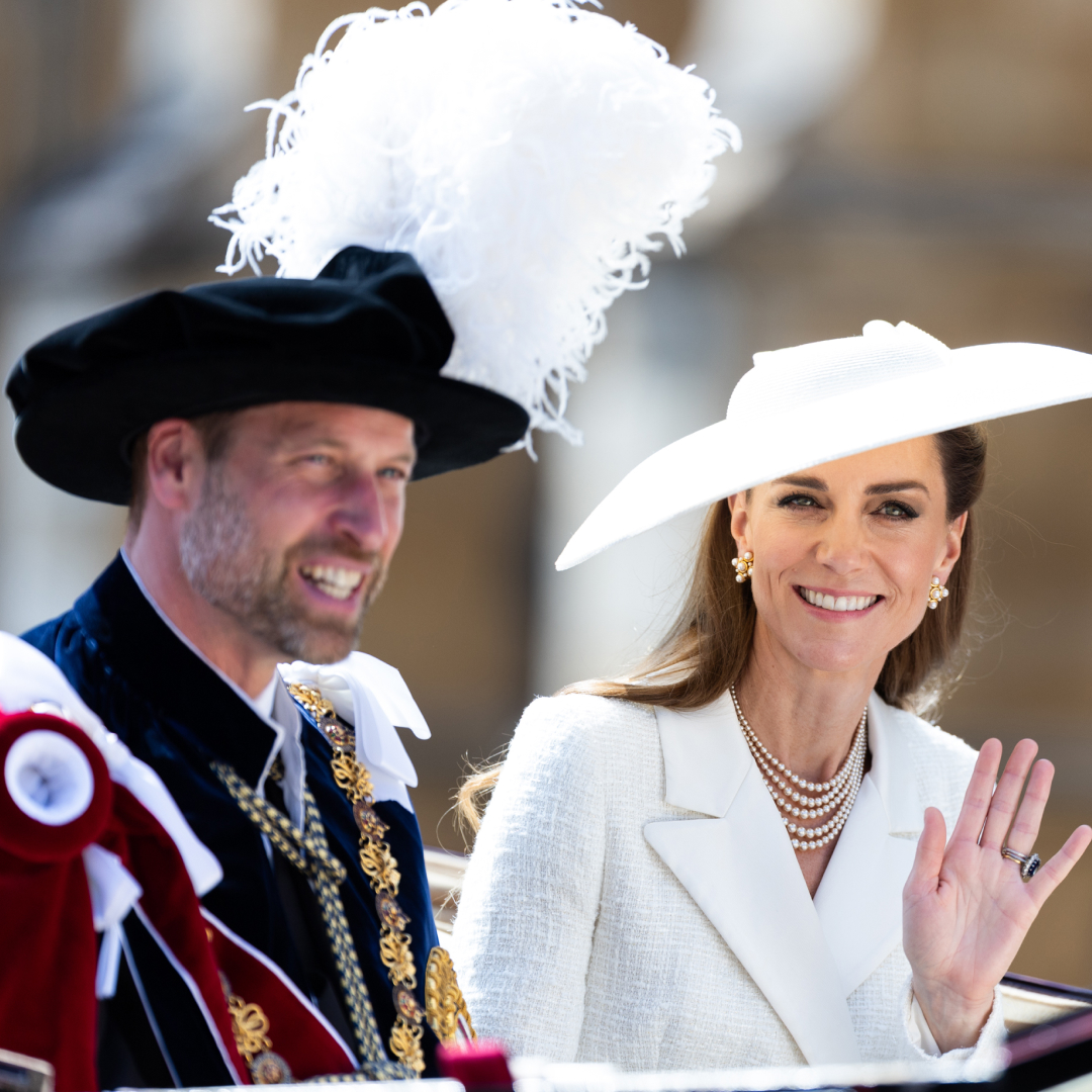 Kate Middleton and Prince William waving from a carriage 