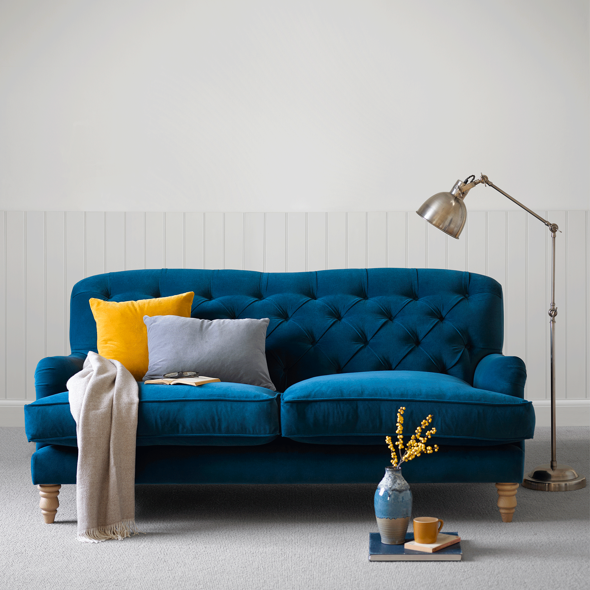 Blue button back sofa