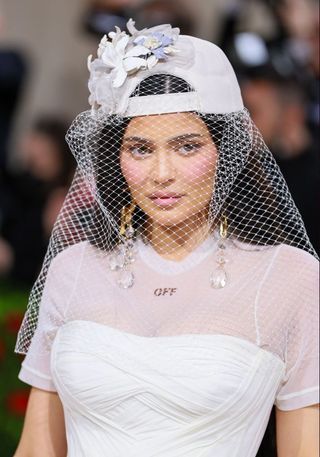 Kylie Jenner wearing pink makeup and a veil at the Met Gala 2022