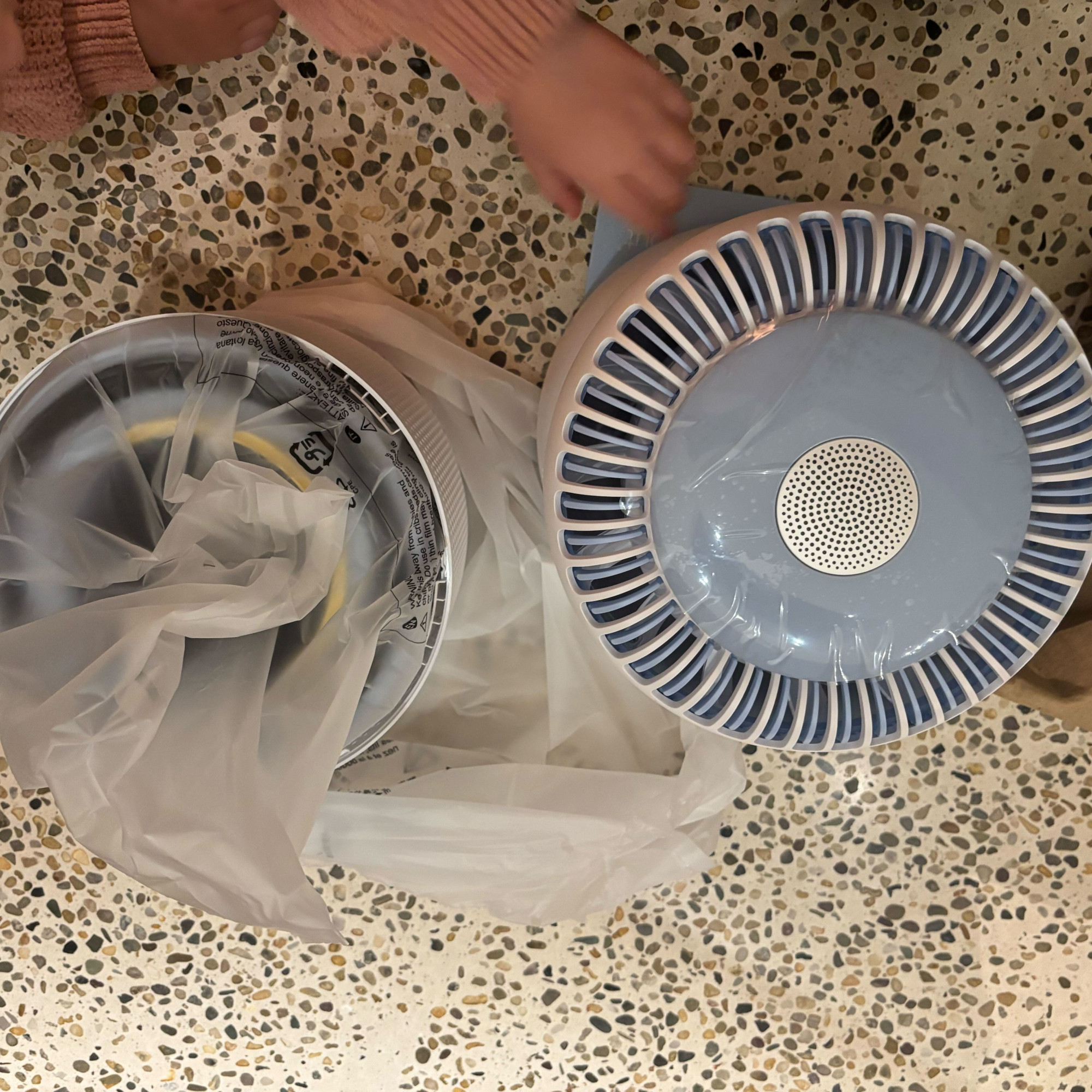 levoit sprout air purifier in packaging on a concrete floor