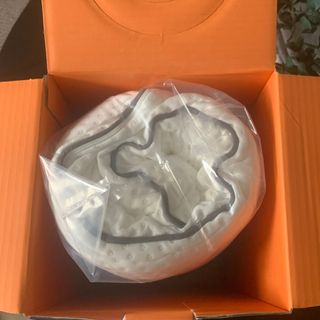 The Emma Foam pillow rolled up in bag in box