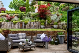 sloping garden ideas: tiered garden with wooden edged borders