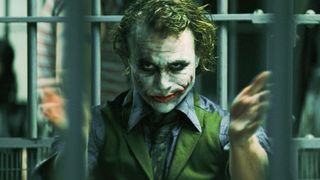 The Dark Knight movie still of The Joker behind bars