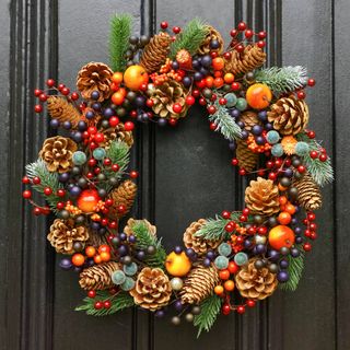 An autumn wreath on a black front door