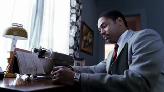 Kelvin Harrison as Martin Luther King Jr. at a desk in Genius: MLK/X episode 4