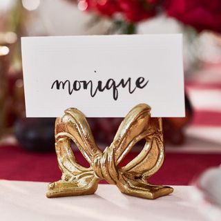 Close up on Monique Lhuillier Holiday Bow Place Card Holder.