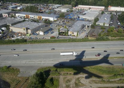 A plane lands near Seattle.