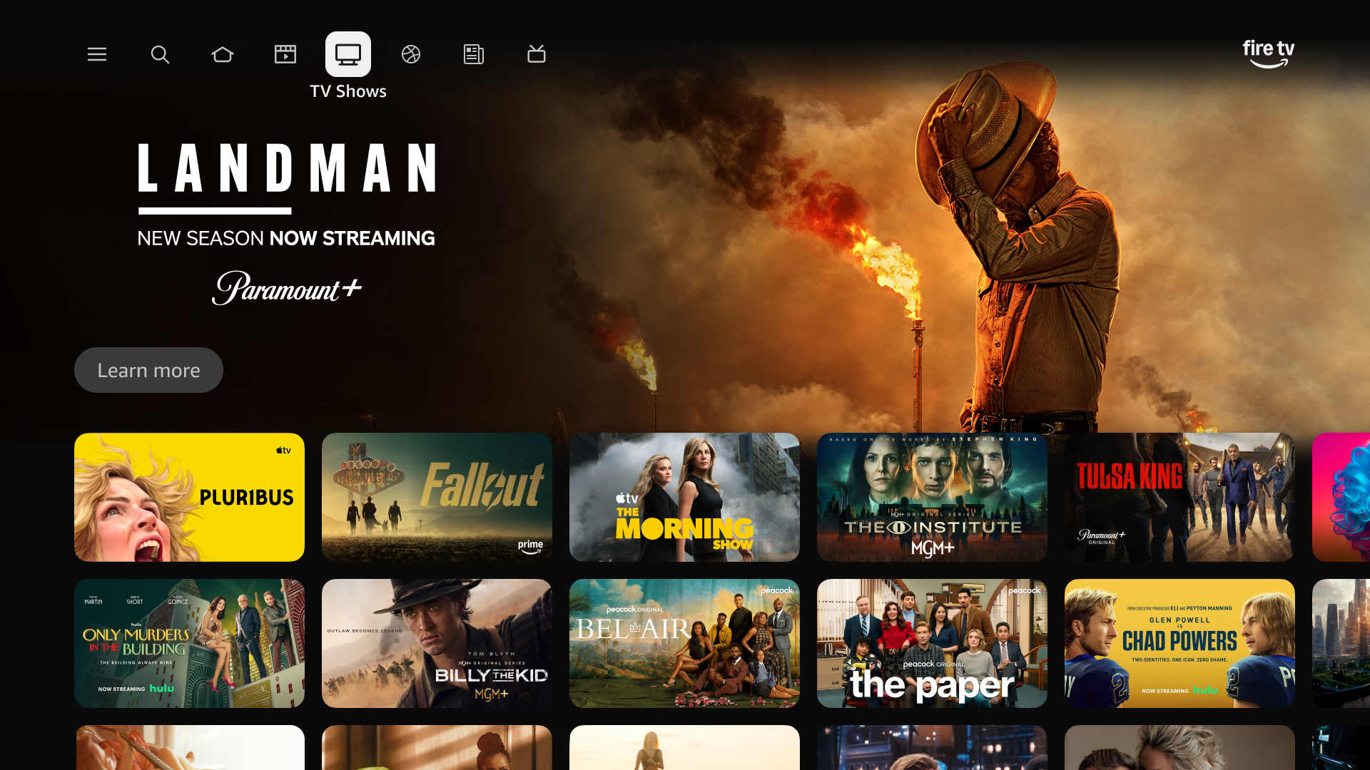 Screenshot of the 2026 Fire TV interface showing a hero image of the Landman show and icons for multiple shows below