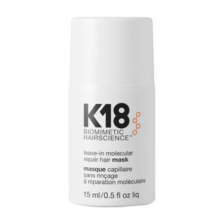 A new, unopened bottle of K18 Mini Leave-In Molecular Repair Hair Mask against a white background.