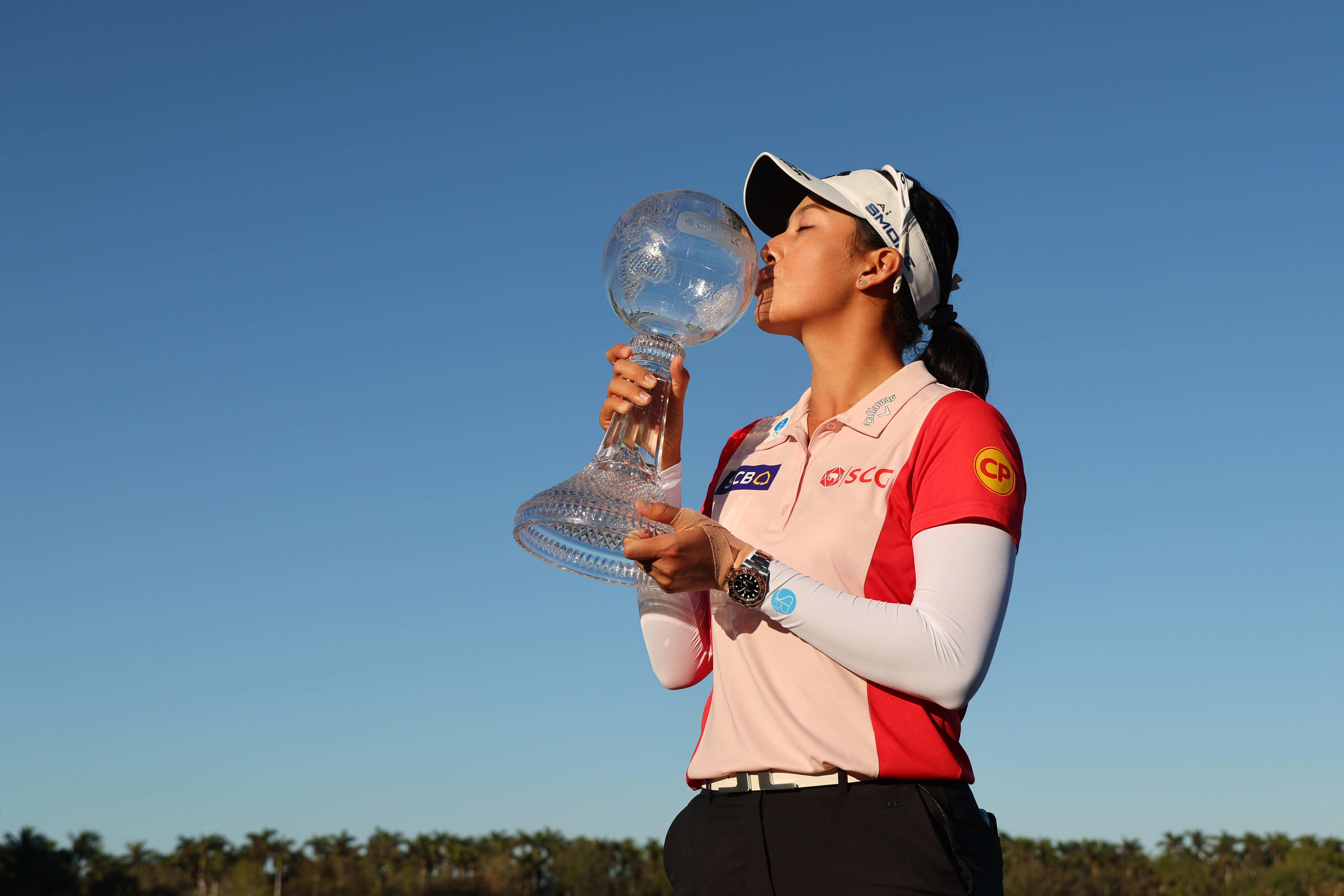 Jeeno Thitikul of Thailand poses with the trophy after winning the CME Group Tour Championship 2024