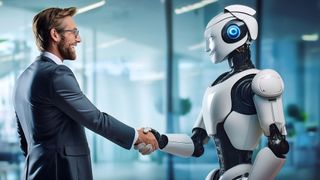 Man and robot shake hands