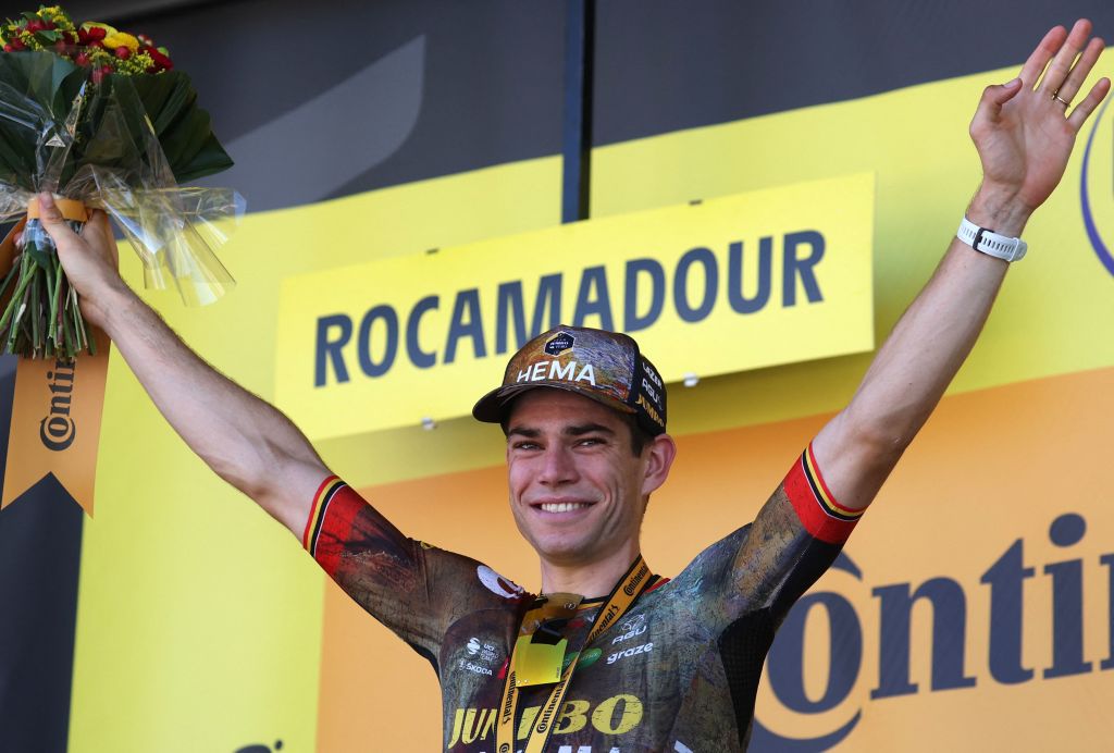 JumboVisma teams Belgian rider Wout Van Aert celebrates his victory on the podium after winning the 20th stage of the 109th edition of the Tour de France cycling race 407 km individual time trial between LacapelleMarival and Rocamadour in southwestern France on July 23 2022 Photo by Thomas SAMSON AFP Photo by THOMAS SAMSONAFP via Getty Images