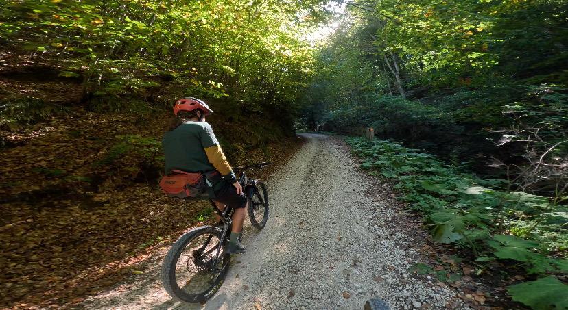 Another cyclist riding to the top, bear spray in his bum bag
