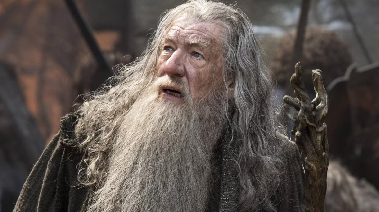 Ian McKellen looking up as Gandalf