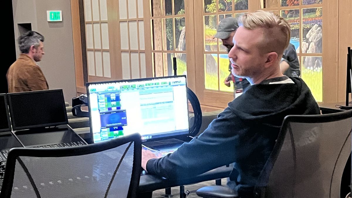 Sound mixer preparing to play isolated tracks in Sony Pictures Studios sound mixing demo